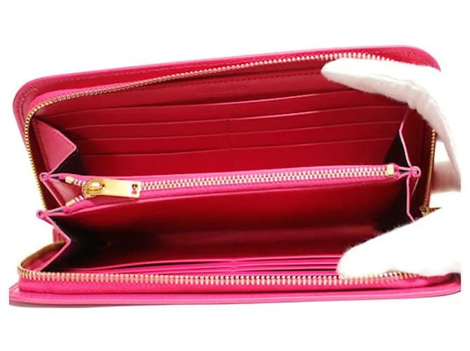 Billetera redonda fucsia Saint Laurent 